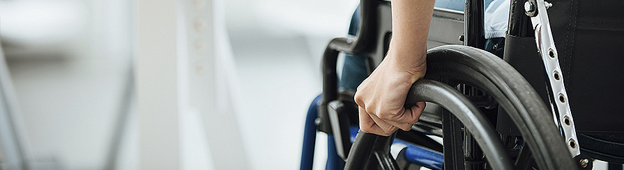 Photo of s fashionable young man in a wheelchair