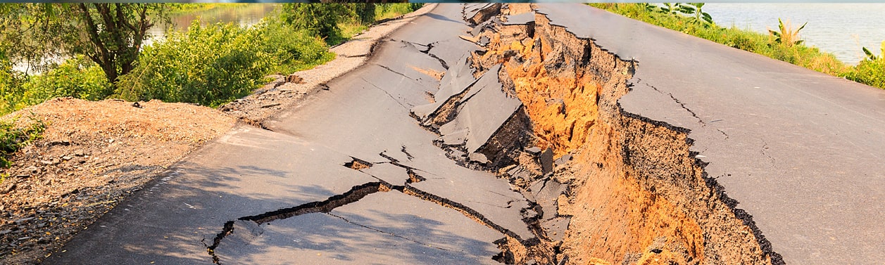 Earthquake damage to a road.